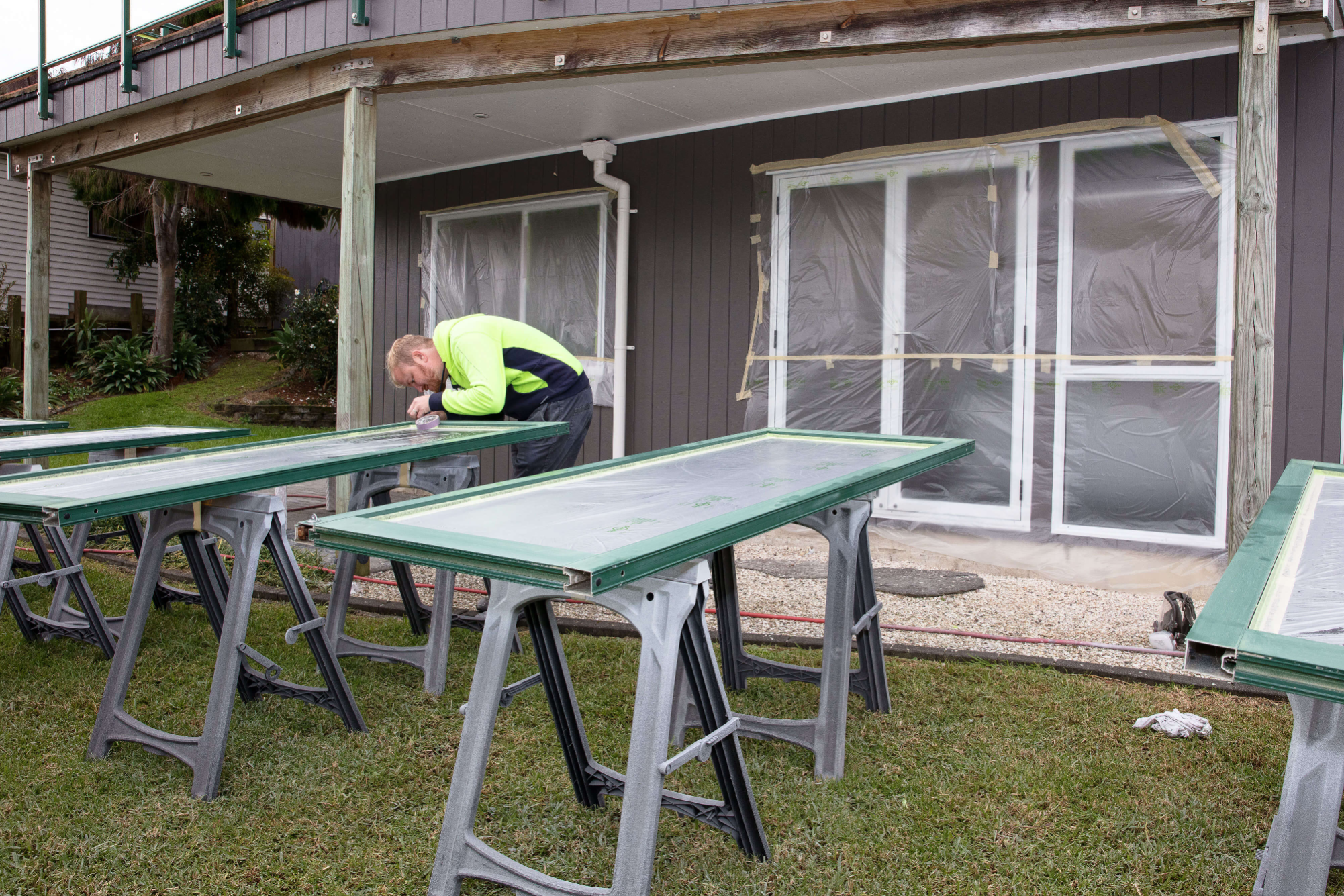 Aluminium window frames are being prepared for painting