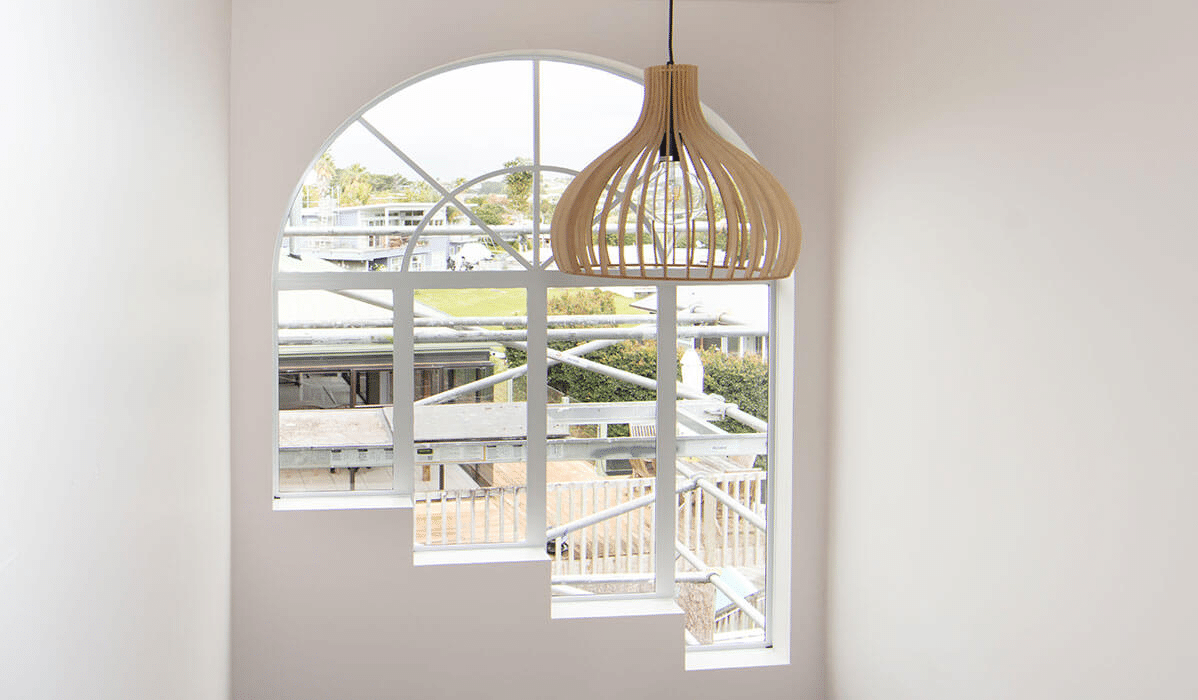 Arched window frames repainted white.