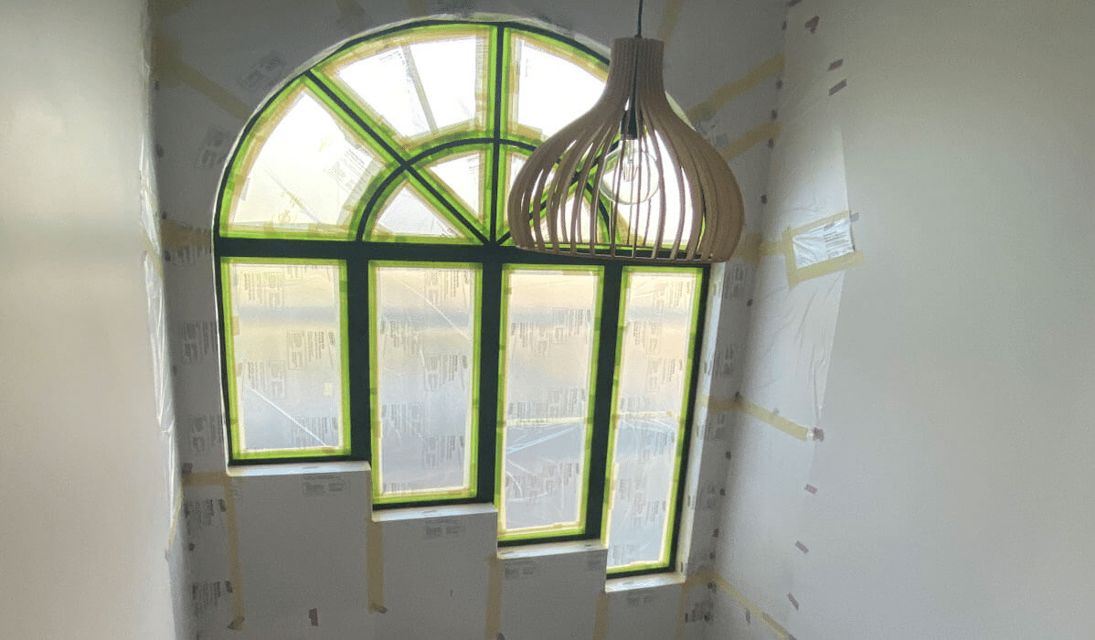 Arch window frames prepped for painting