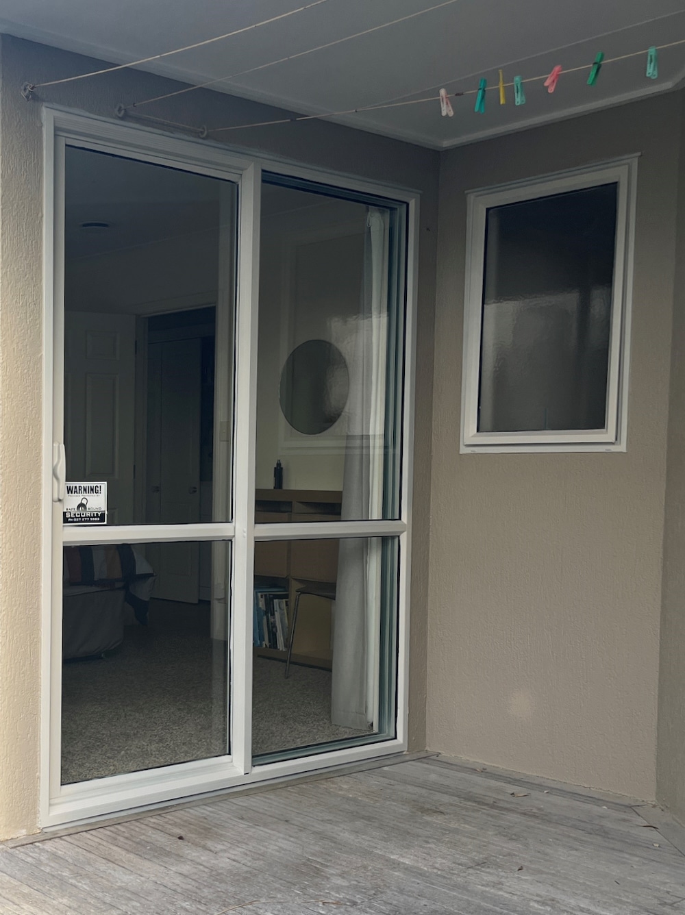 After After painting the aluminium joinery is clean and modern in offwhite.
